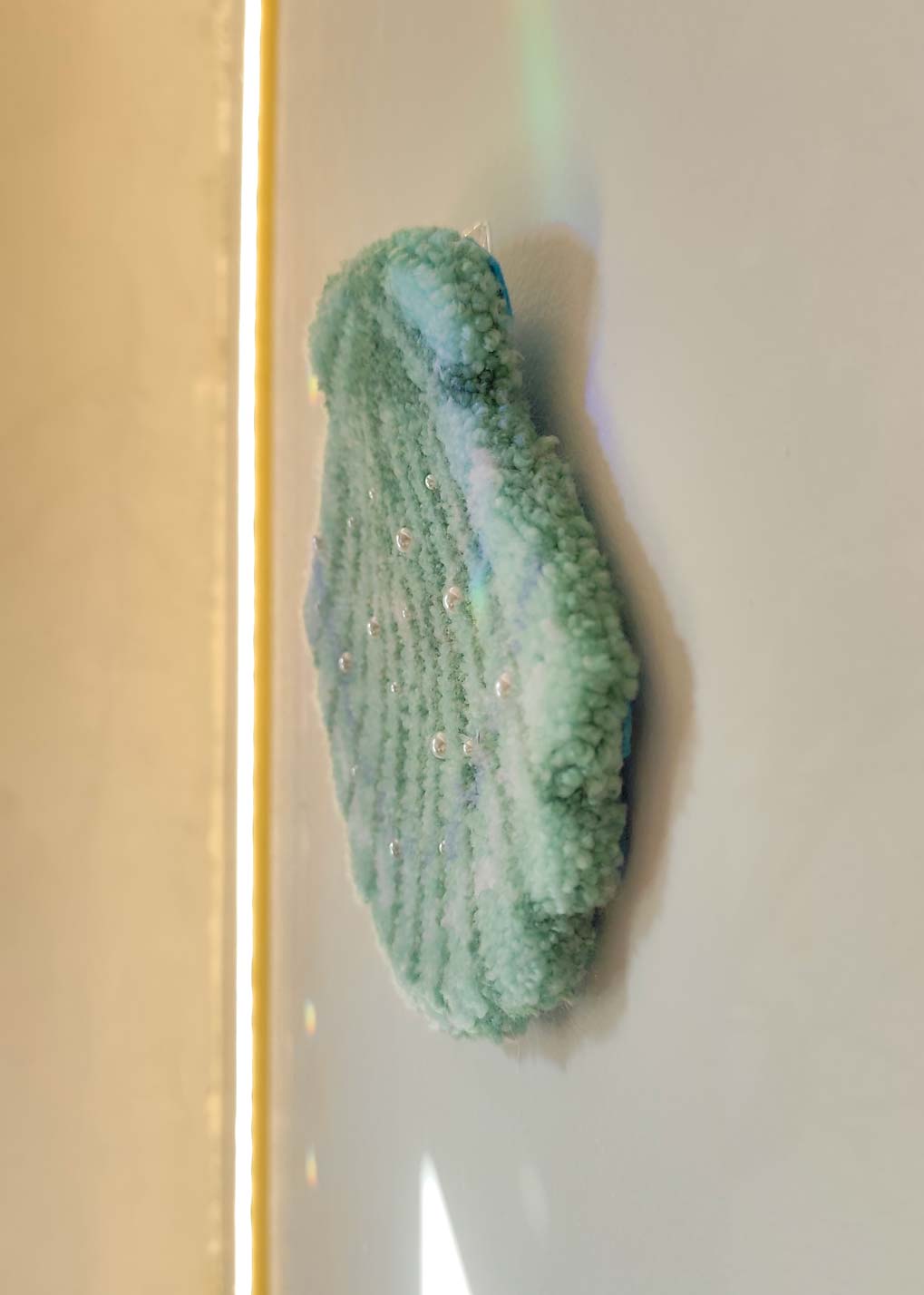 Décoration murale tuftée - coquillage perlé